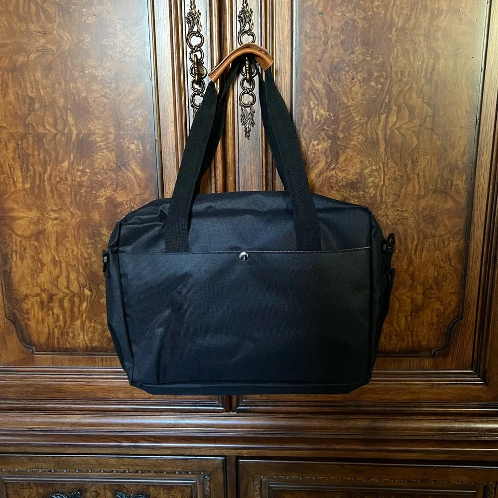 NWT The Journeyman Bag Co Duffle Bag in black with red mesh interior.
